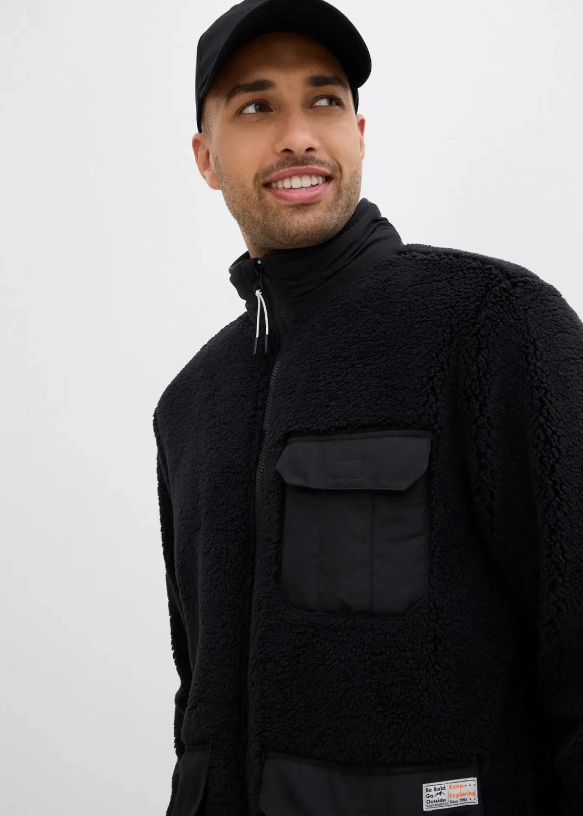 bonprix Große Größen|Sweat|Teddy-Fleece Jacke mit praktischen Taschen und sportiven Details schwarz